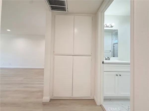 a bathroom with a sink a mirror and a vanity