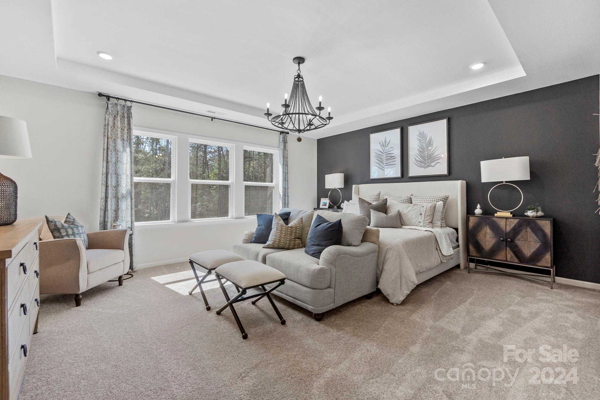13229 Chopin Ridge Road Huntersville, NC 28078 - Photo 20 of 34 a spacious bedroom with bed and a large window