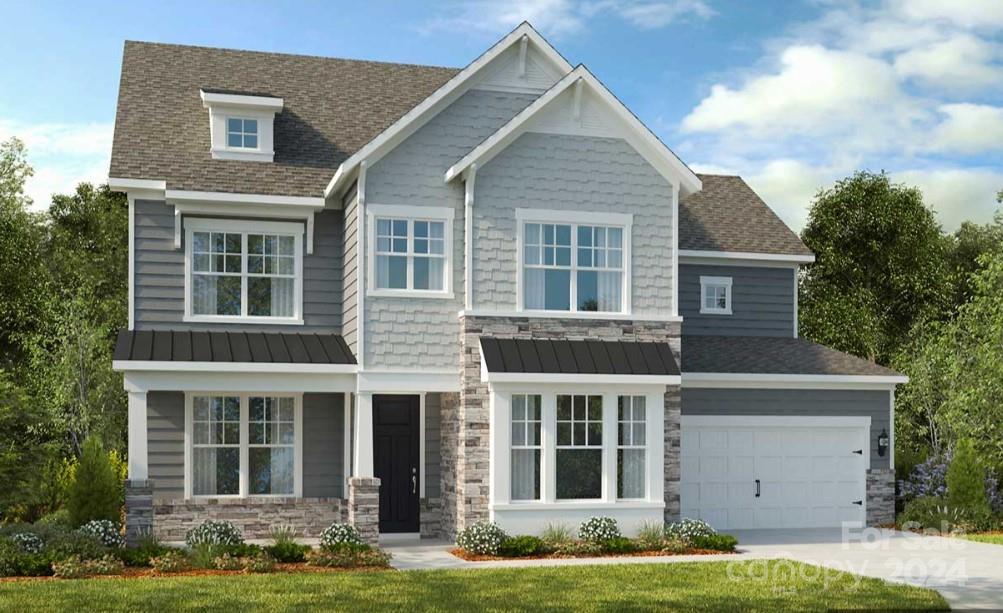 13229 Chopin Ridge Road Huntersville, NC 28078 - Photo 2 of 34 a front view of a house with a yard and garage