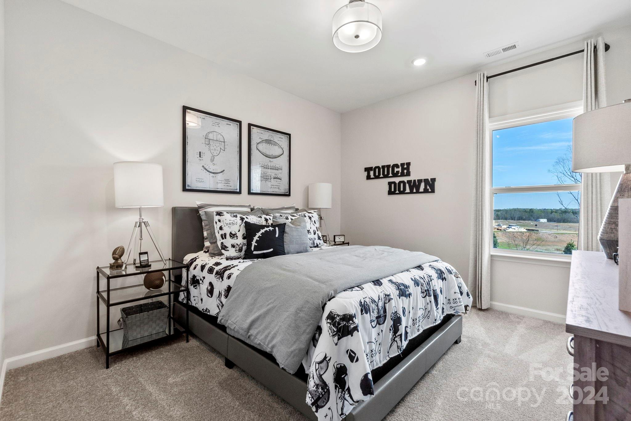 13229 Chopin Ridge Road Huntersville, NC 28078 - Photo 25 of 34 a bedroom with a bed and a window