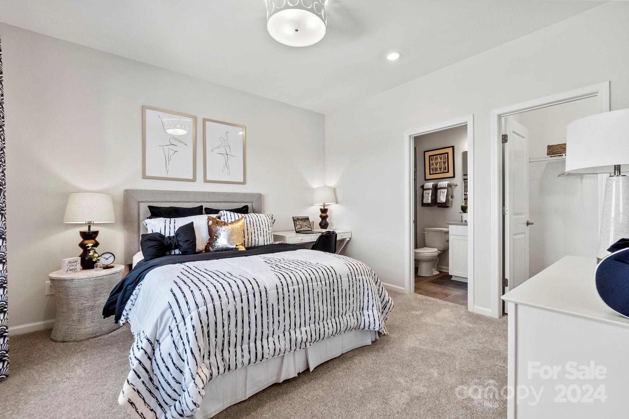 13229 Chopin Ridge Road Huntersville, NC 28078 - Photo 28 of 34 a bedroom with a bed and a lamp