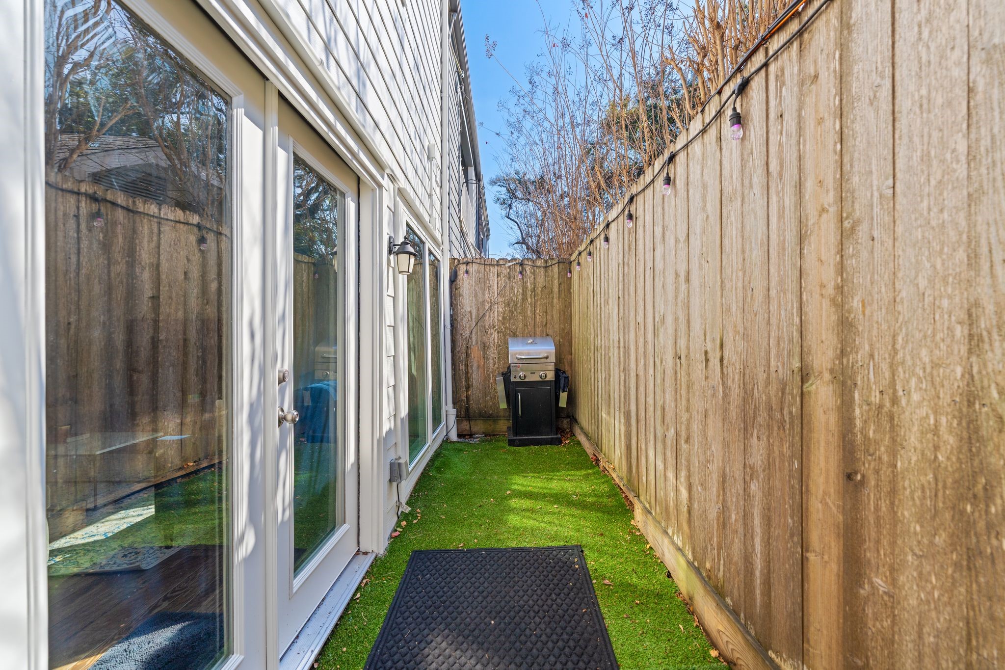 2612 Yupon Street Houston, TX 77006 - Photo 7 of 41 Private turfed backyard provides low maintenance outdoor space ideal for entertaining, pets, or relaxing in the heart of Montrose.