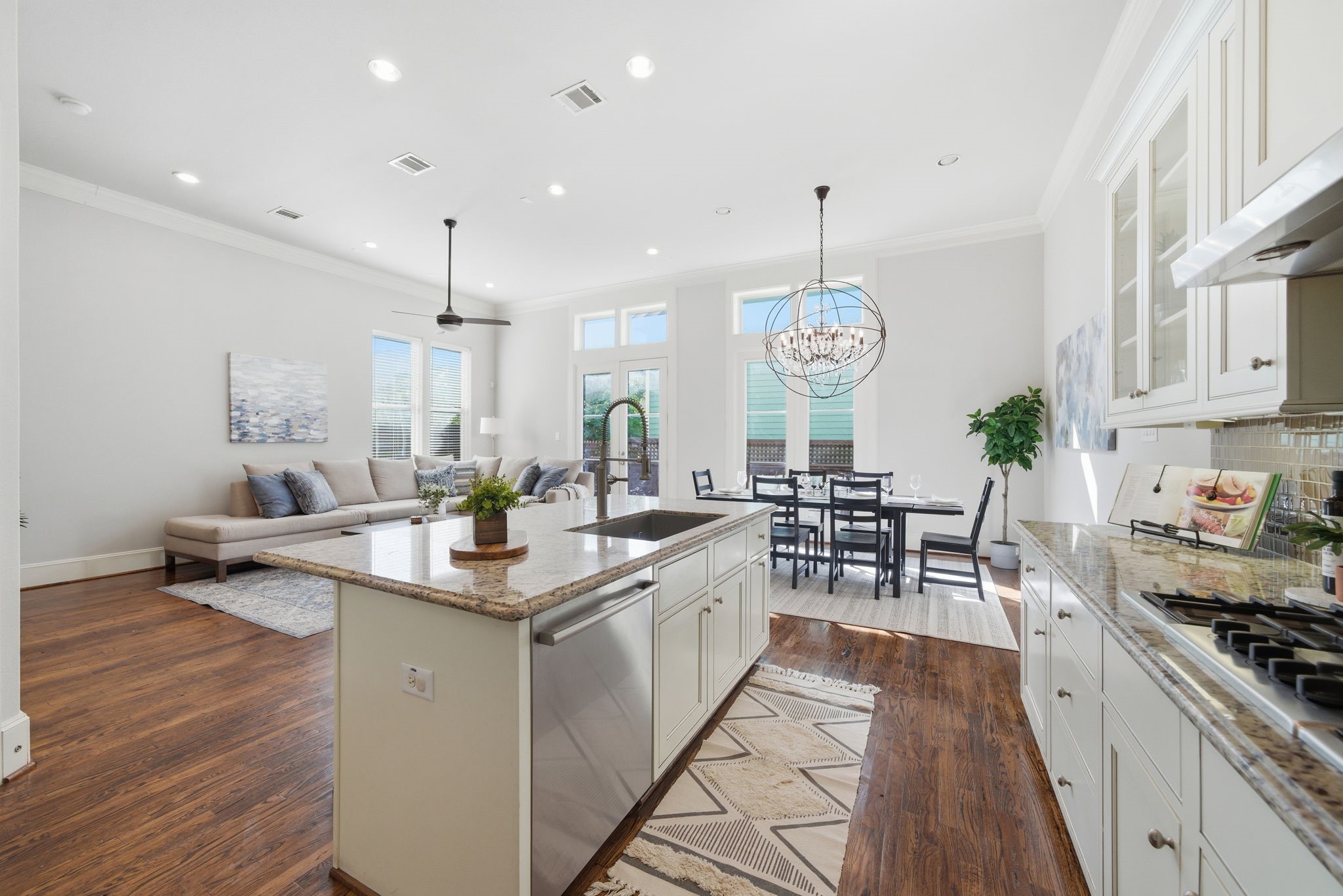 1360 West 25th Street Houston, TX 77008 - Photo 12 of 37 a large kitchen with lots of counter space a sink dining table and chairs