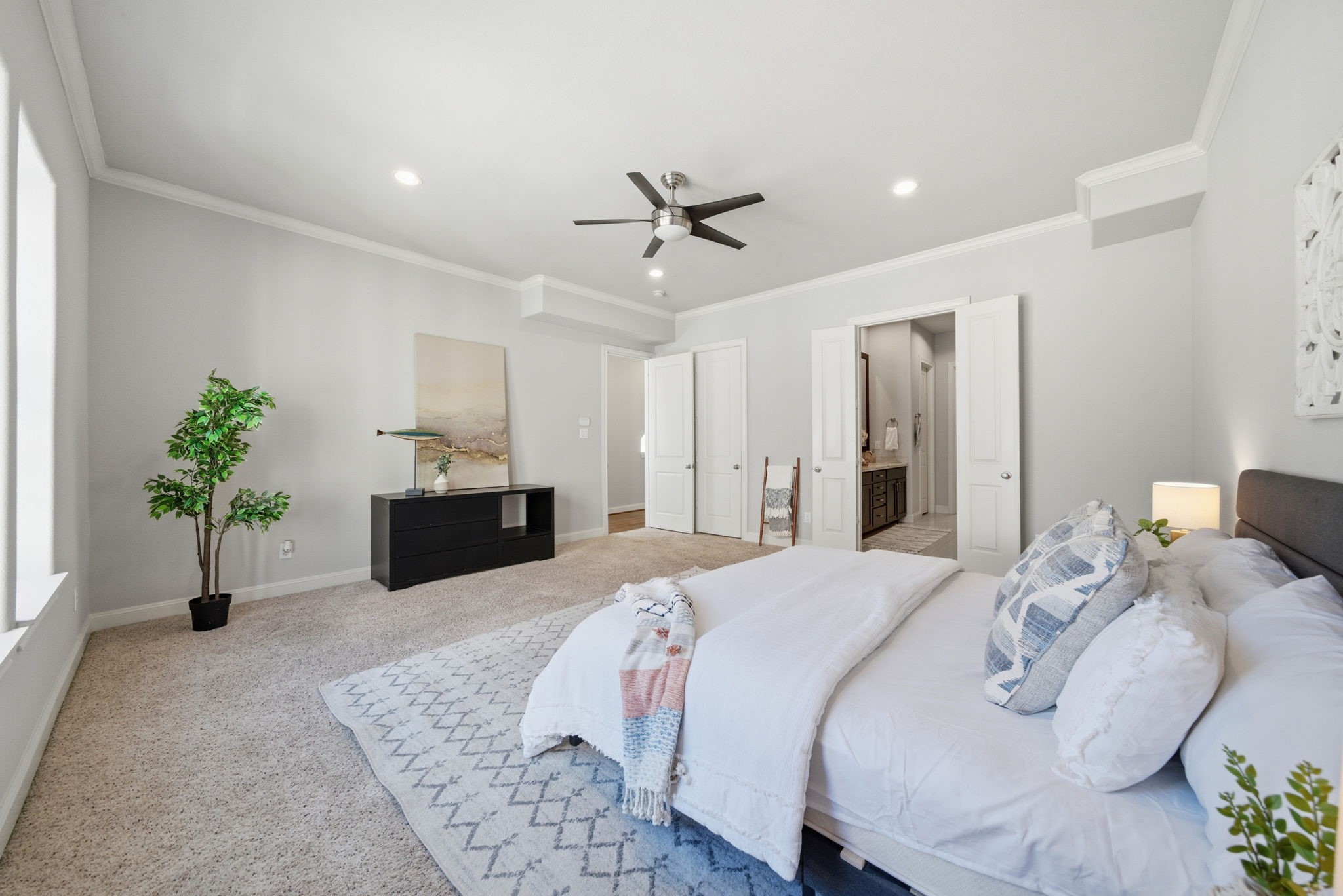 1360 West 25th Street Houston, TX 77008 - Photo 18 of 37 a bedroom with a bed potted plant with the dresser and mirror