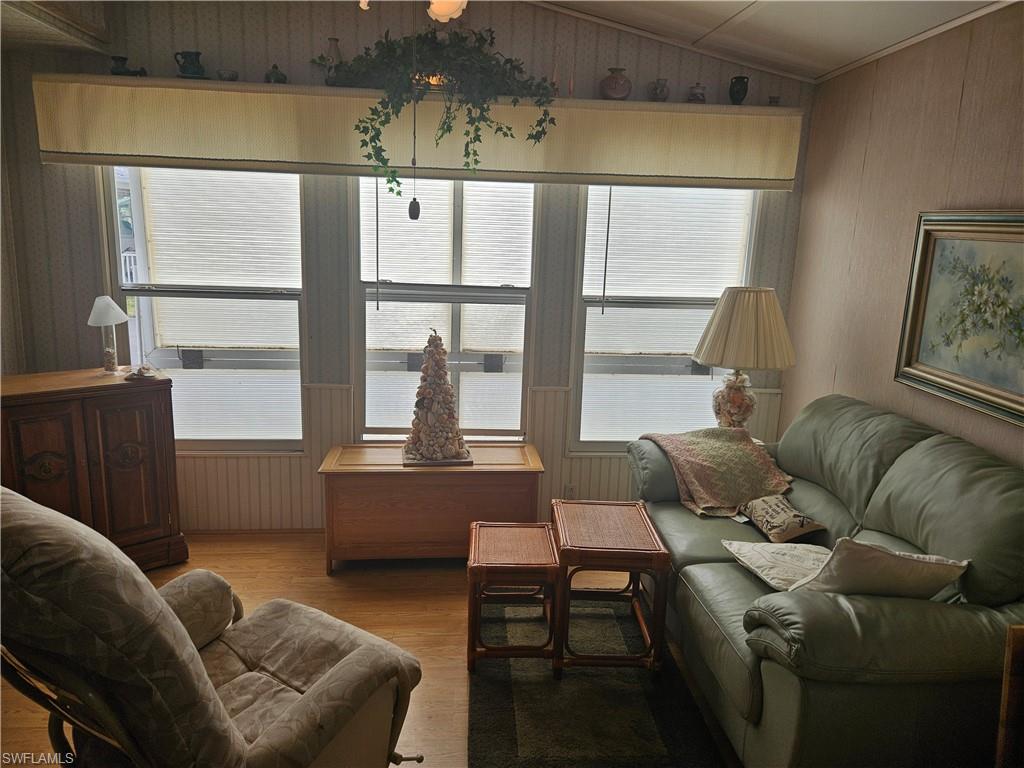 27 Amethyst Avenue, Unit 27A Naples, FL 34114 - Photo 11 of 27 a living room with furniture and a window