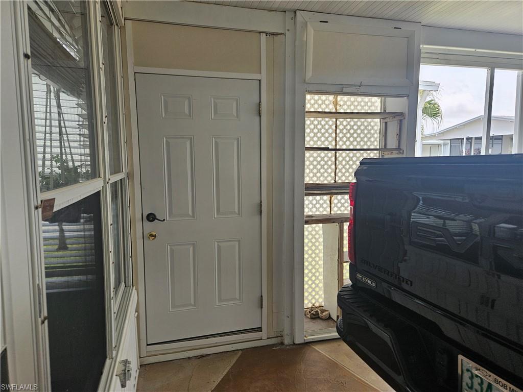 27 Amethyst Avenue, Unit 27A Naples, FL 34114 - Photo 25 of 27 a view of an empty room and window