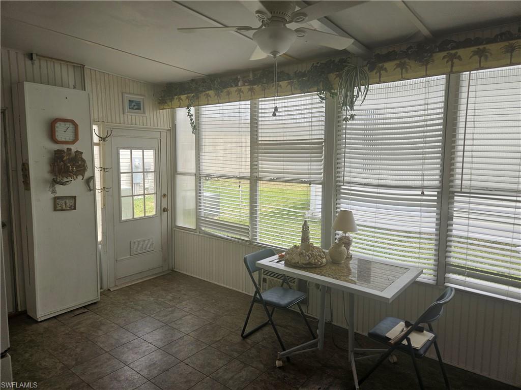 27 Amethyst Avenue, Unit 27A Naples, FL 34114 - Photo 5 of 27 a view of a dining room with furniture and chandelier