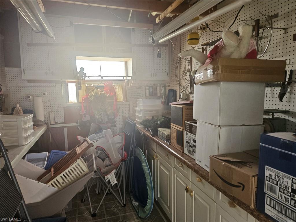27 Amethyst Avenue, Unit 27A Naples, FL 34114 - Photo 6 of 27 a view of a chairs and table in a kitchen