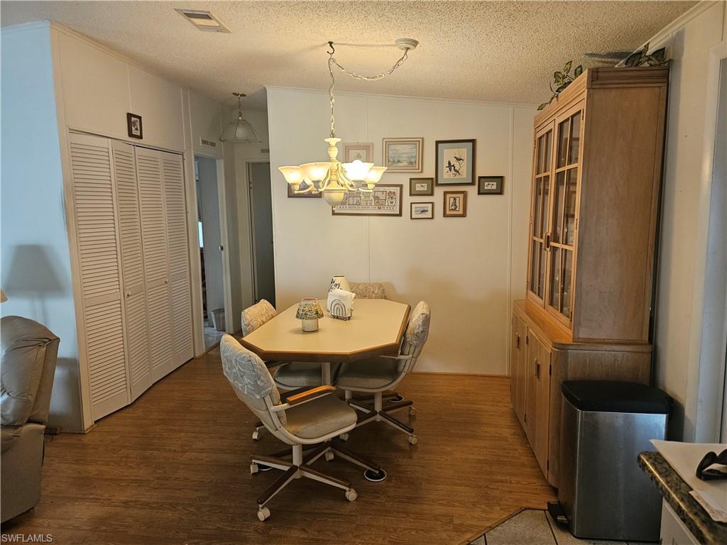 27 Amethyst Avenue, Unit 27A Naples, FL 34114 - Photo 8 of 27 a view of a dining room with furniture