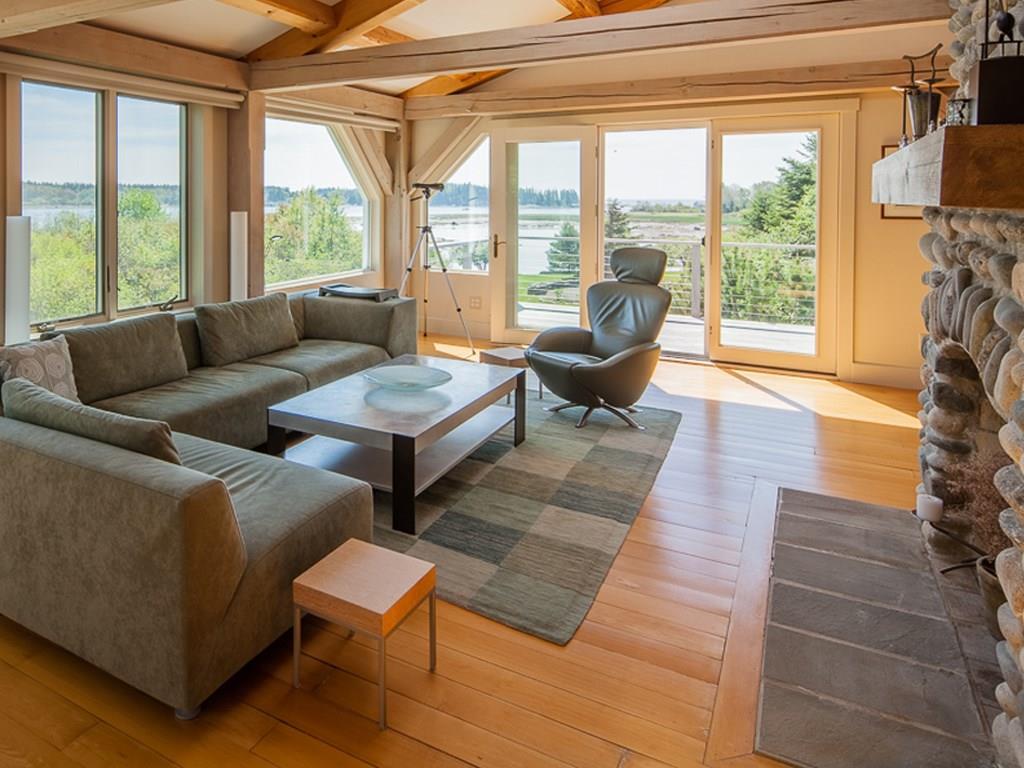 516 Port Clyde Road Tenants Harbor, ME 04860 - Photo 4 of 15 The living room is bathed in natural...