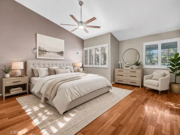 a bedroom with a large bed and a large window