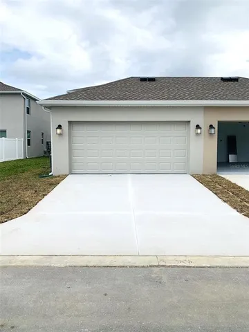 a view of kitchen with stainless steel appliances kitchen island sink refrigerator and stove