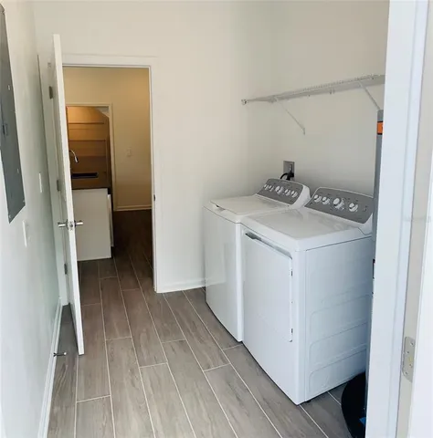 a view of a storage & utility room with a washer dryer