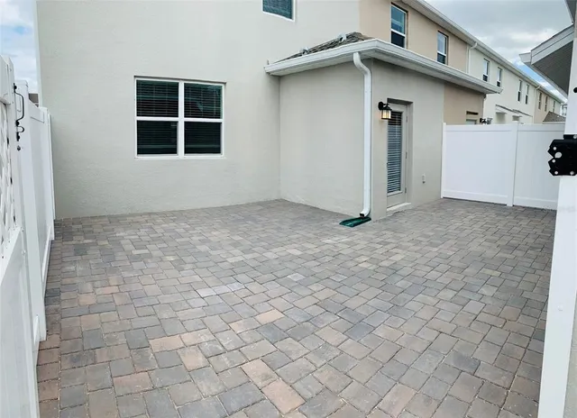 a view of a house with white door and a door