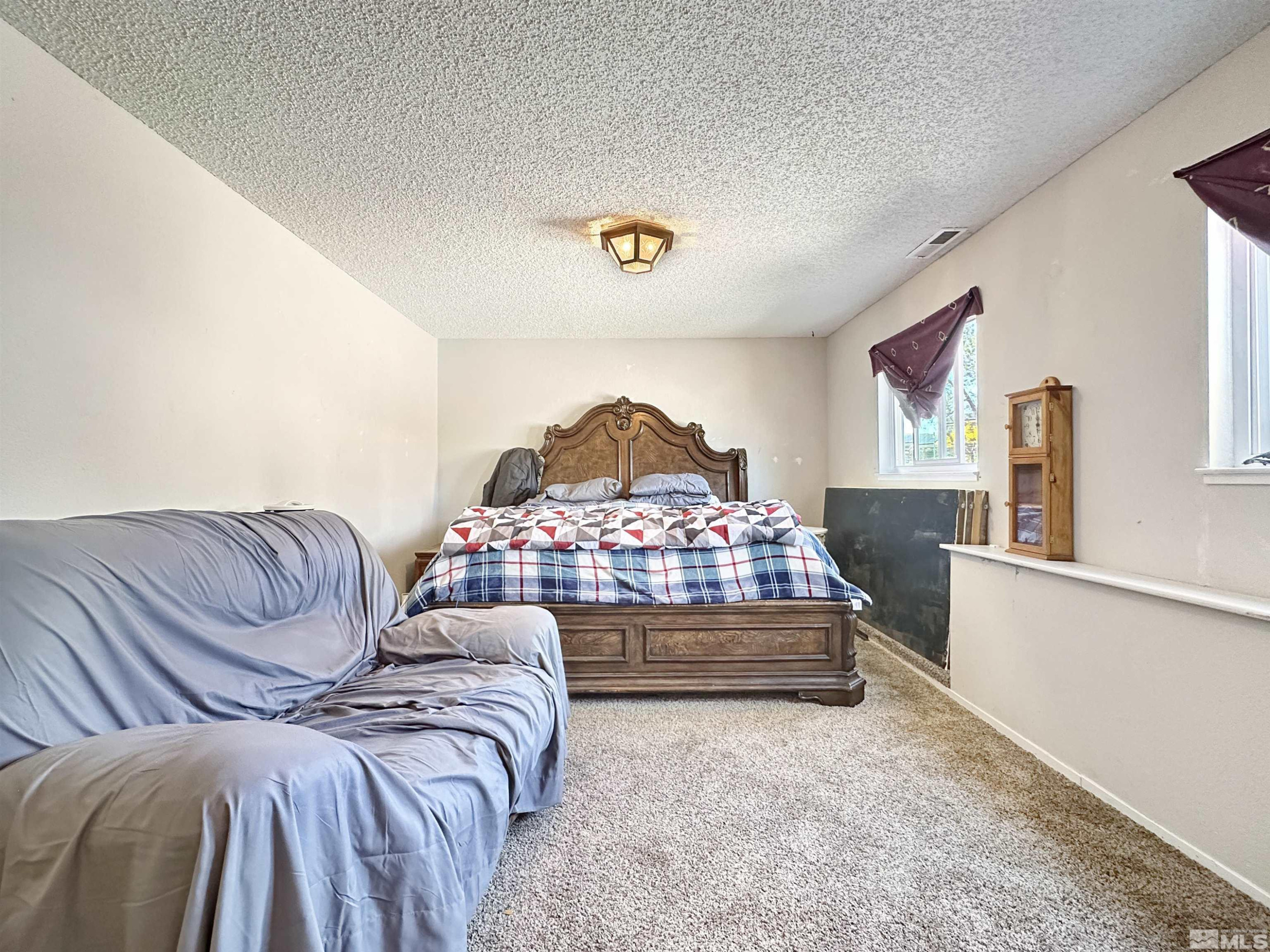 11595 Vicksburg Road Reno, NV 89508 - Photo 12 of 18 a bedroom with a bed and window