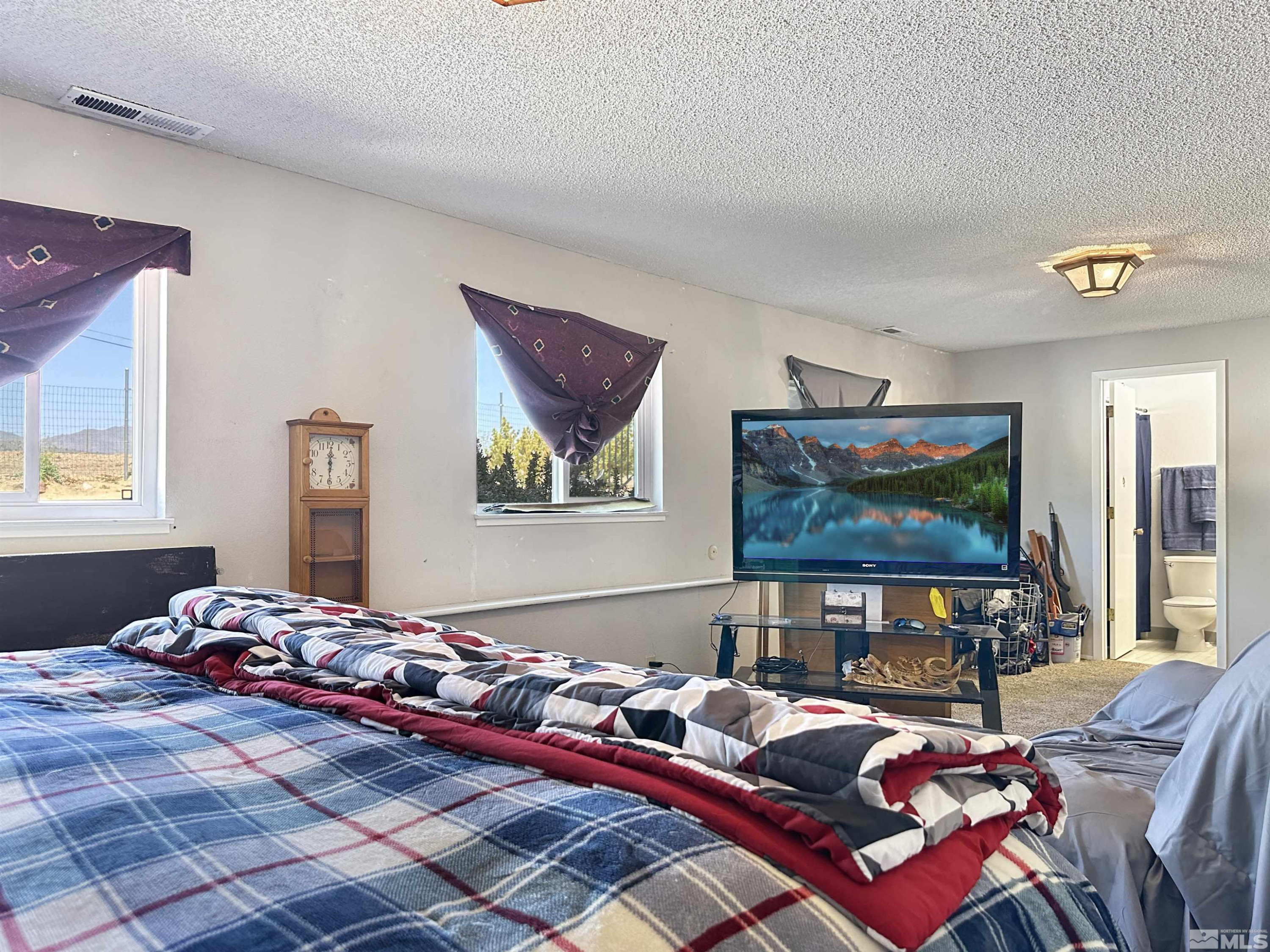 11595 Vicksburg Road Reno, NV 89508 - Photo 13 of 18 a living room with furniture and a flat screen tv
