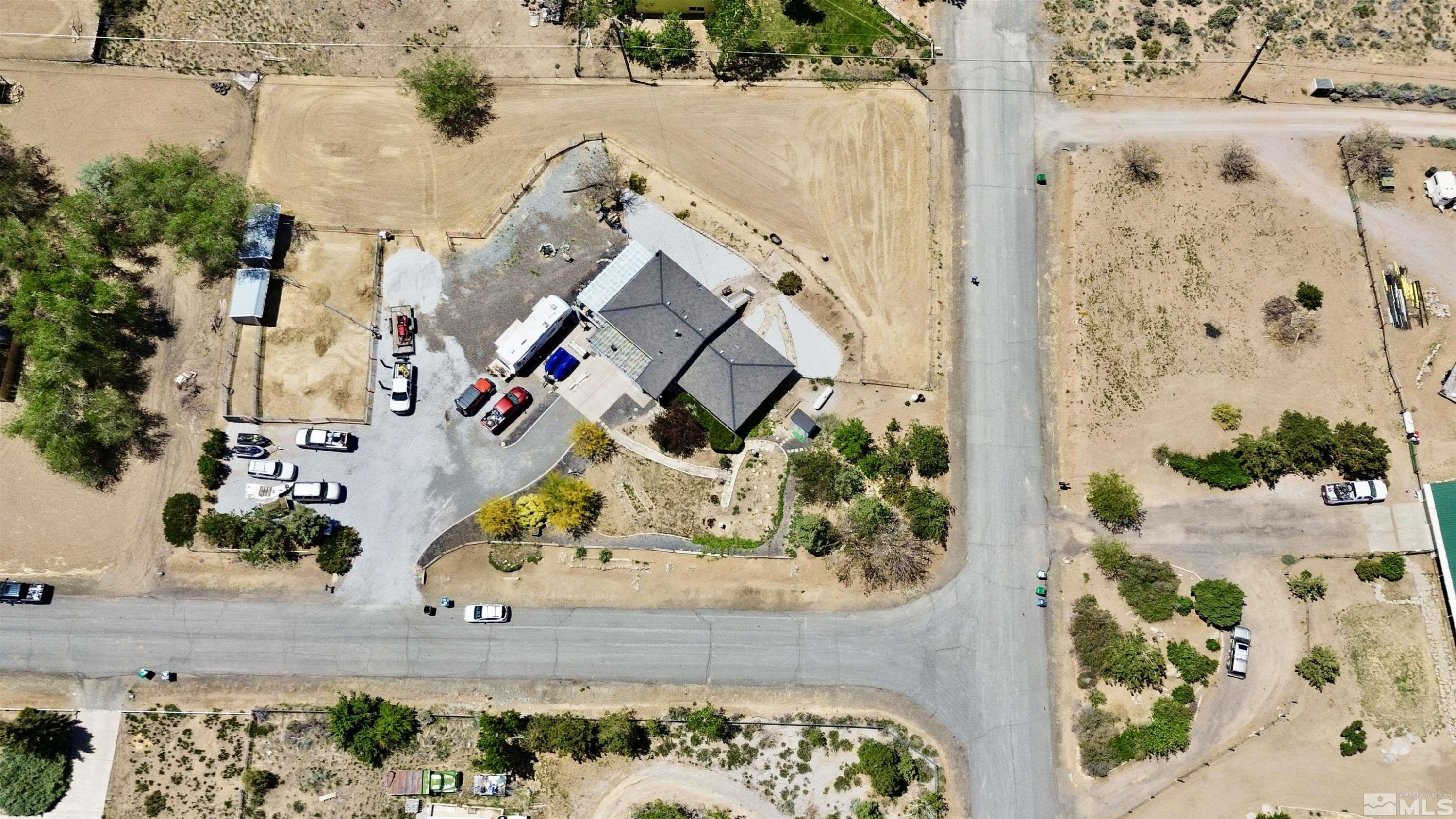 11595 Vicksburg Road Reno, NV 89508 - Photo 17 of 18 an aerial view of a house with a yard and a wooden fence