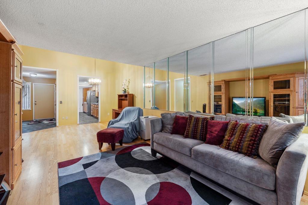 1518 Goldrush Way Oceanside, CA 92057 - Photo 6 of 36 a living room with furniture window and a wooden floor