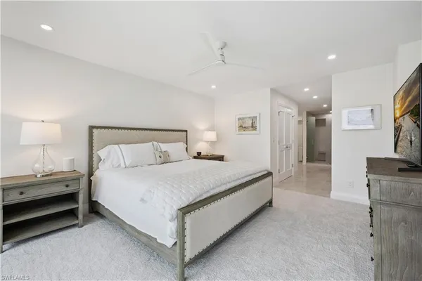 a bed room with a bed and a lamp