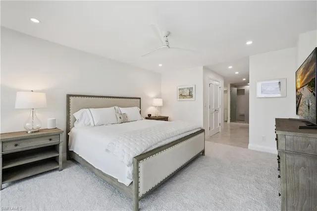 a bed room with a bed and a lamp