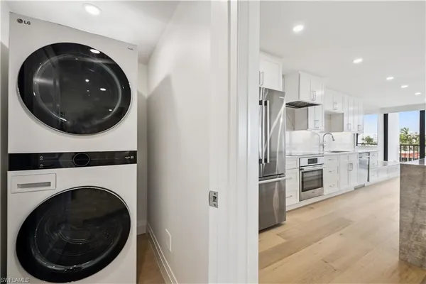a kitchen with a washer and dryer