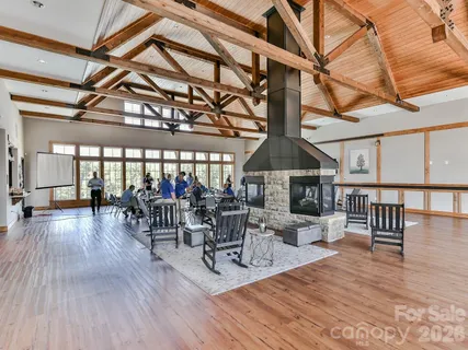a living room with lots of furniture and a wooden floor