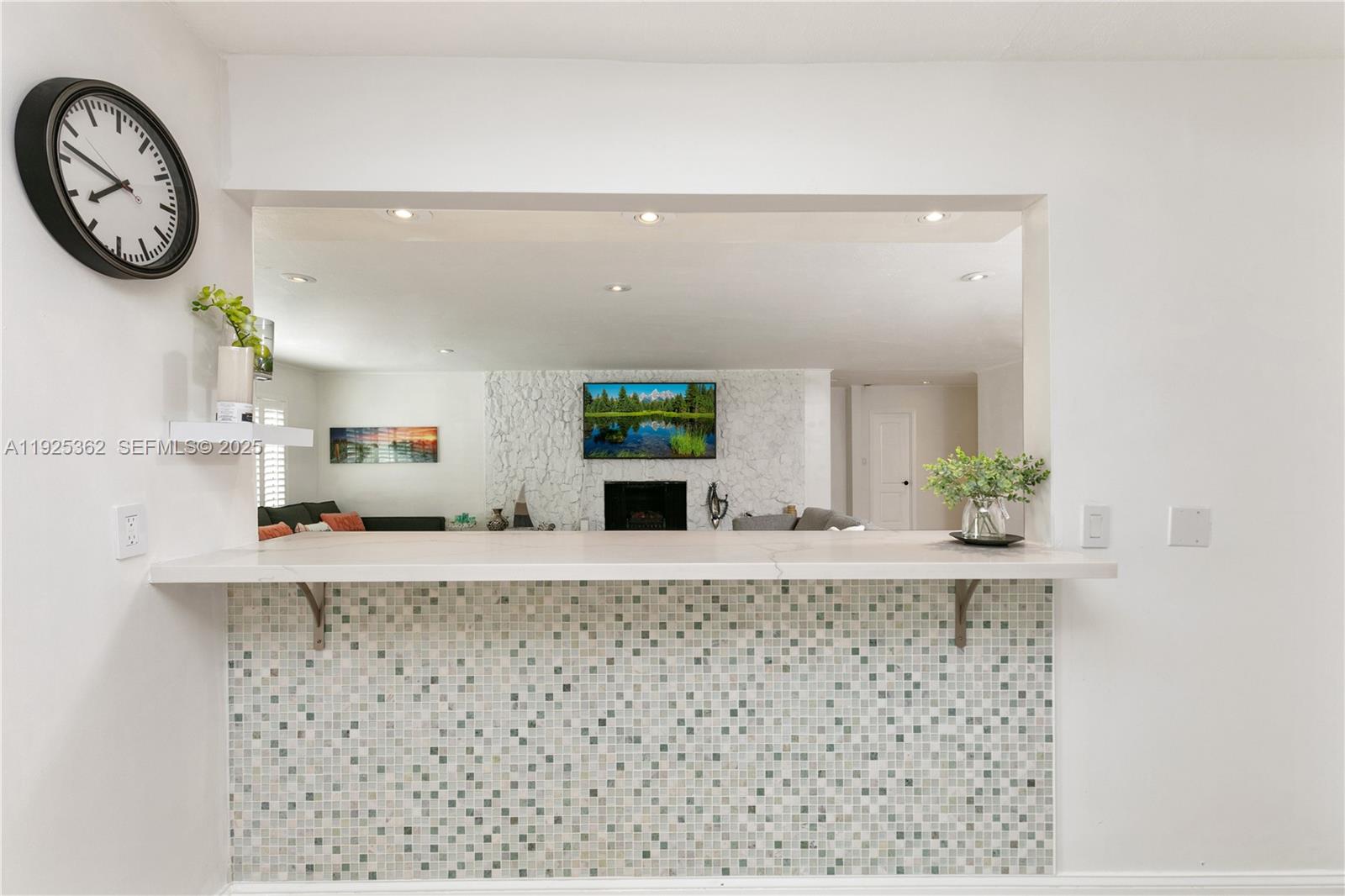 1900 North Victoria Park Road Fort Lauderdale, FL 33305 - Photo 16 of 60 a bathroom with a granite countertop sink and a mirror