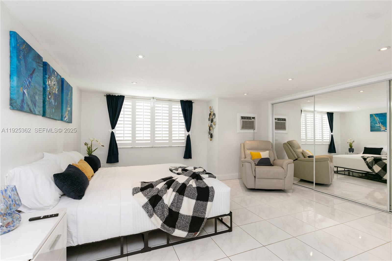 1900 North Victoria Park Road Fort Lauderdale, FL 33305 - Photo 17 of 60 a bedroom with a bed and a couch