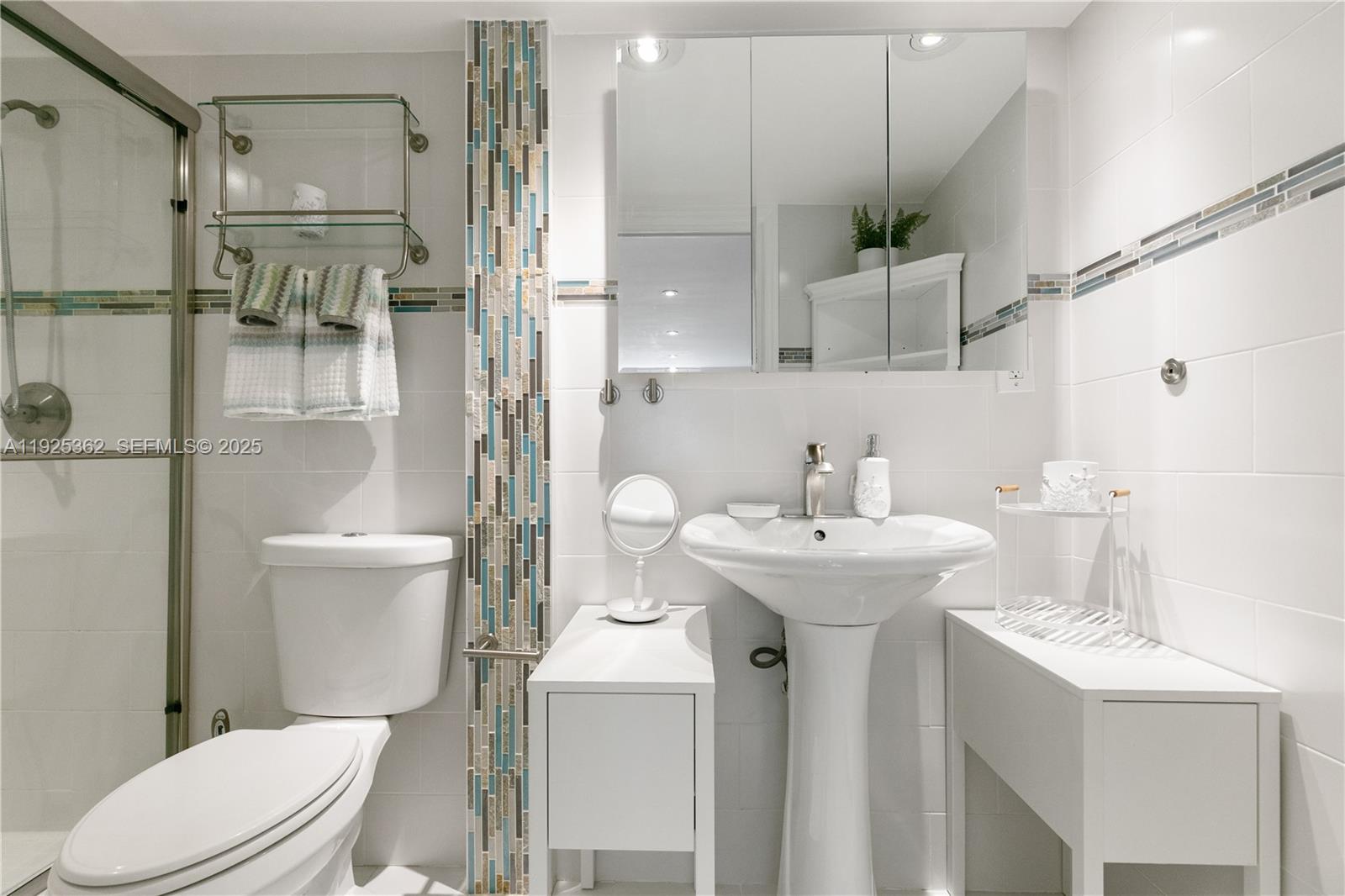 1900 North Victoria Park Road Fort Lauderdale, FL 33305 - Photo 20 of 60 a bathroom with a sink a toilet and shower