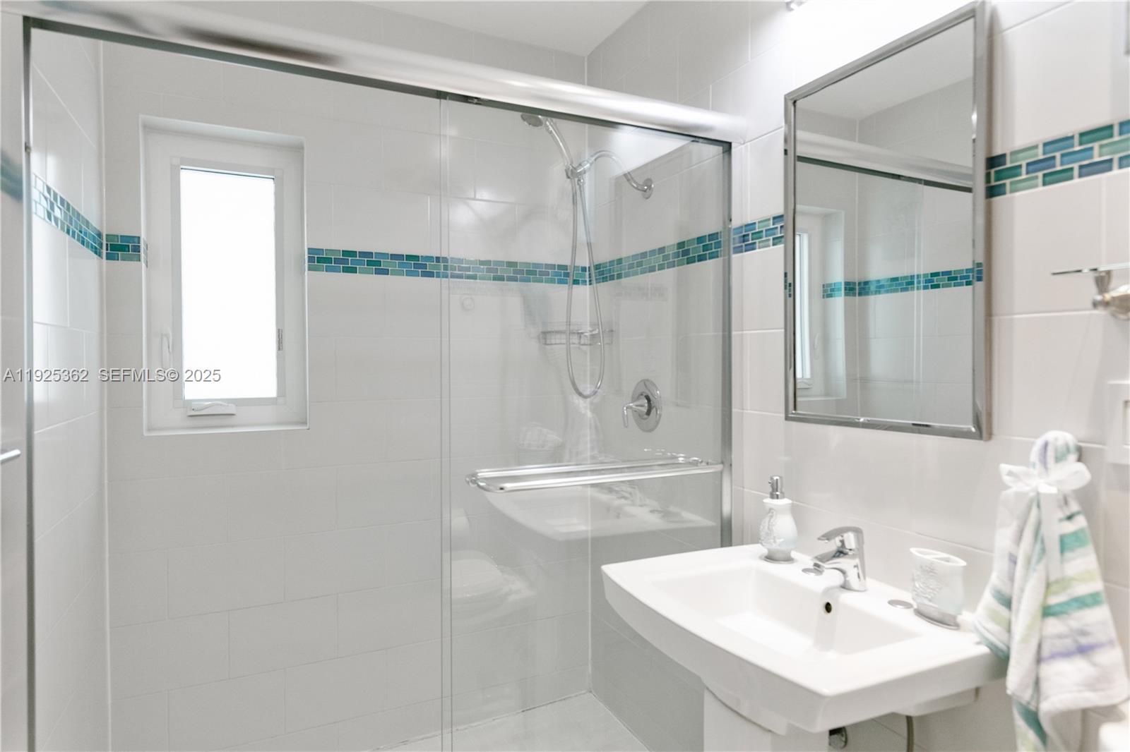 1900 North Victoria Park Road Fort Lauderdale, FL 33305 - Photo 27 of 60 a bathroom with a shower and a sink