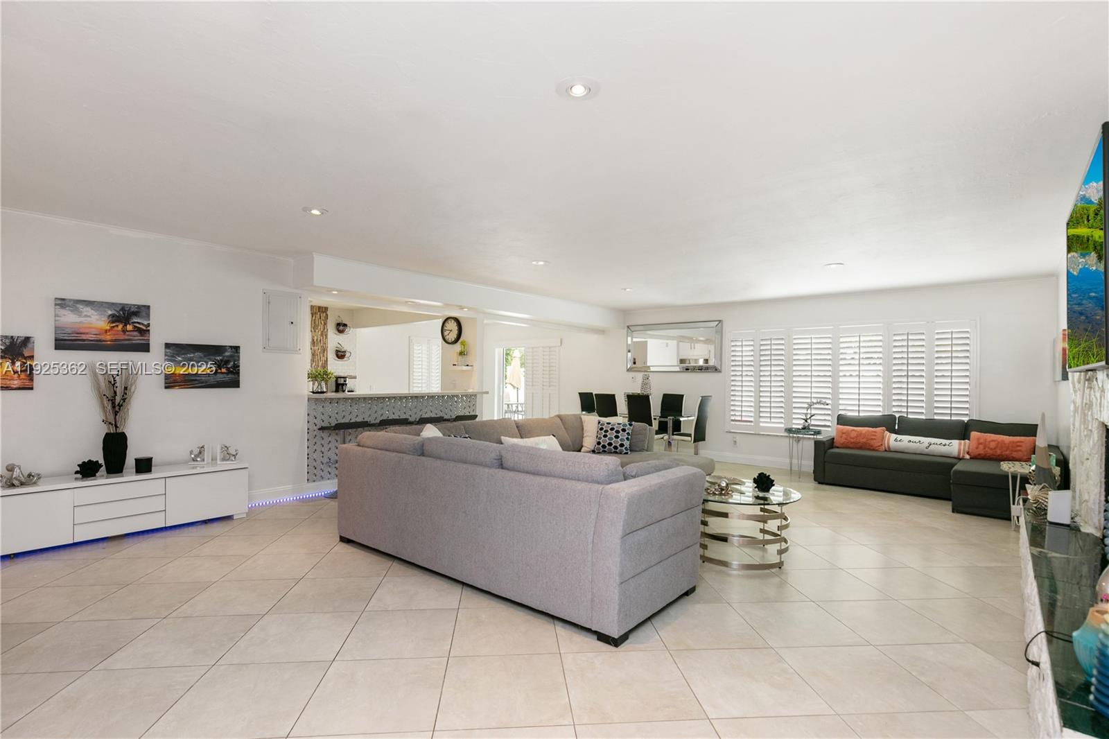 1900 North Victoria Park Road Fort Lauderdale, FL 33305 - Photo 3 of 60 a living room with furniture and a flat screen tv