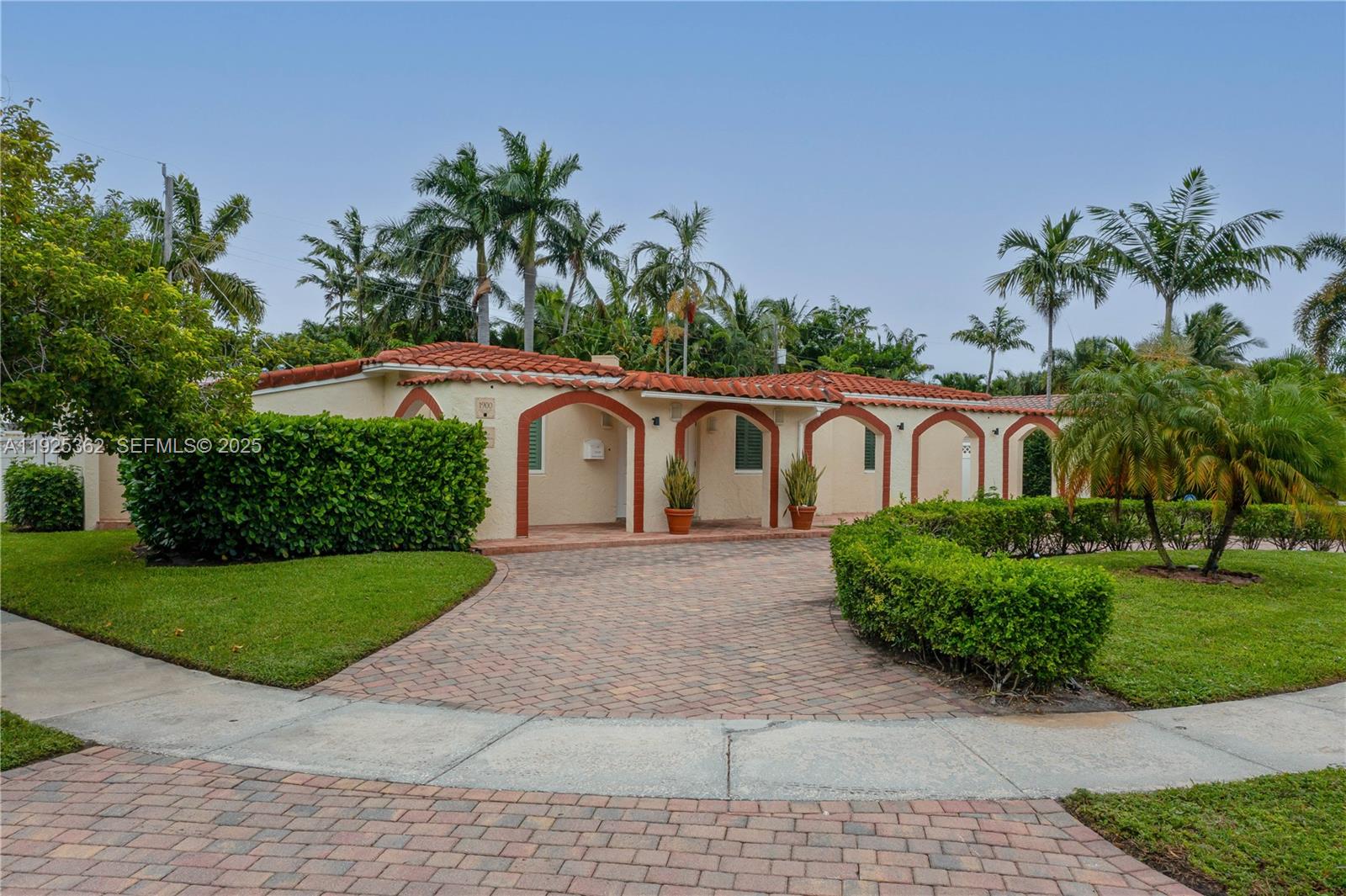 1900 North Victoria Park Road Fort Lauderdale, FL 33305 - Photo 34 of 60 a front view of a house with garden