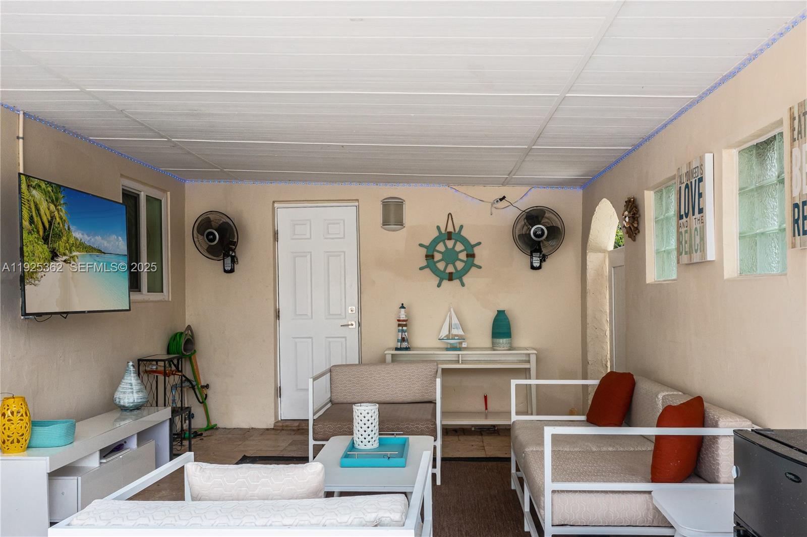 1900 North Victoria Park Road Fort Lauderdale, FL 33305 - Photo 42 of 60 a living room with furniture and a potted plant