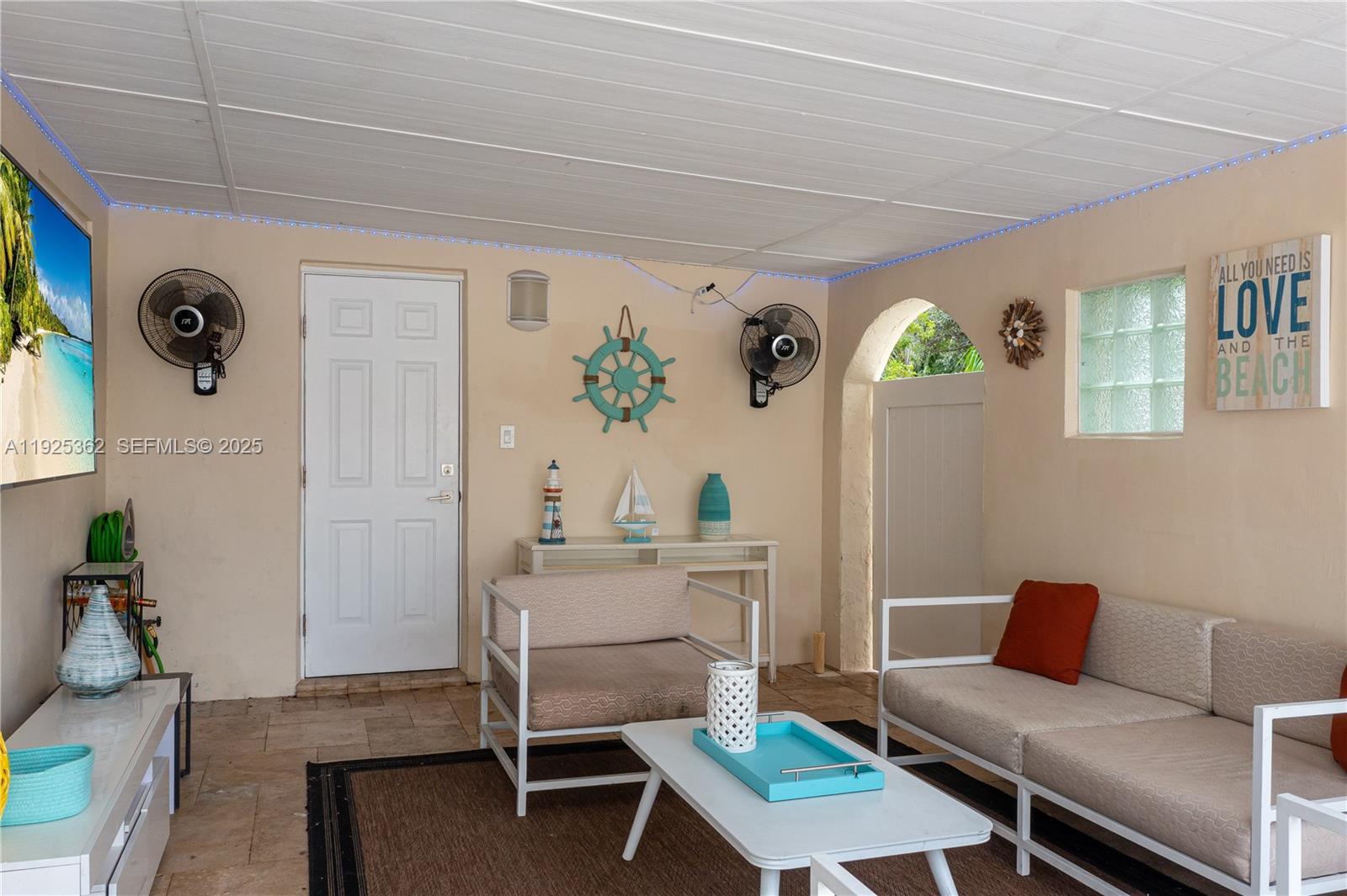 1900 North Victoria Park Road Fort Lauderdale, FL 33305 - Photo 43 of 60 a living room with furniture and a window