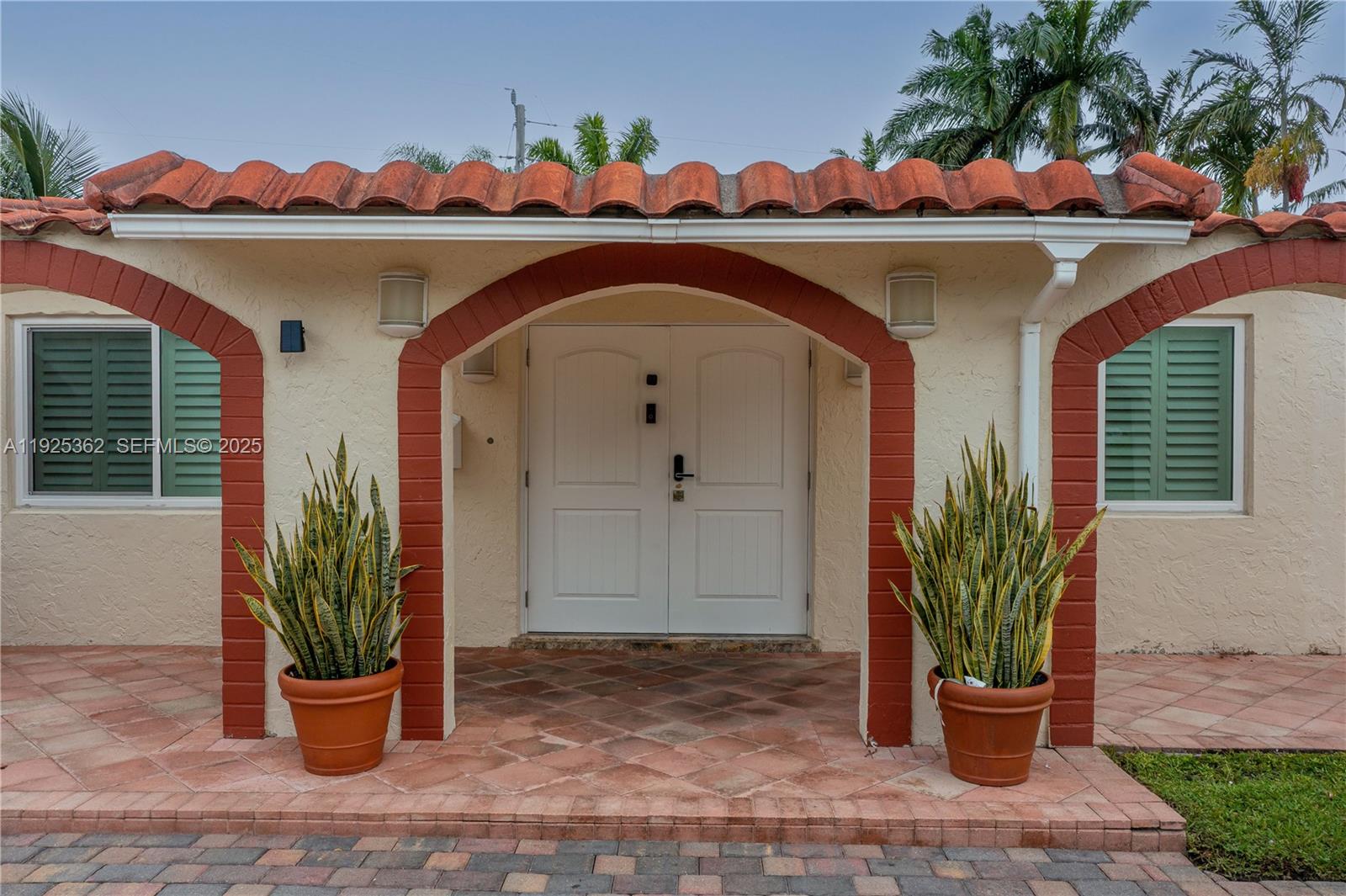 1900 North Victoria Park Road Fort Lauderdale, FL 33305 - Photo 48 of 60 a front view of a house with a potted plant