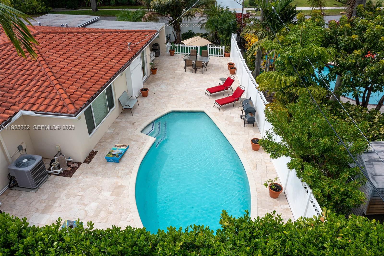 1900 North Victoria Park Road Fort Lauderdale, FL 33305 - Photo 59 of 60 an aerial view of a house with swimming pool and garden