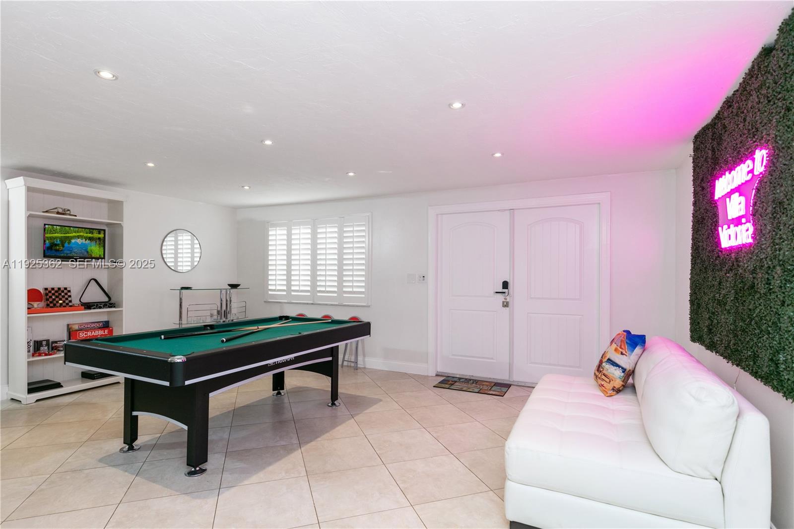 1900 North Victoria Park Road Fort Lauderdale, FL 33305 - Photo 6 of 60 a living room with furniture and a flat screen tv