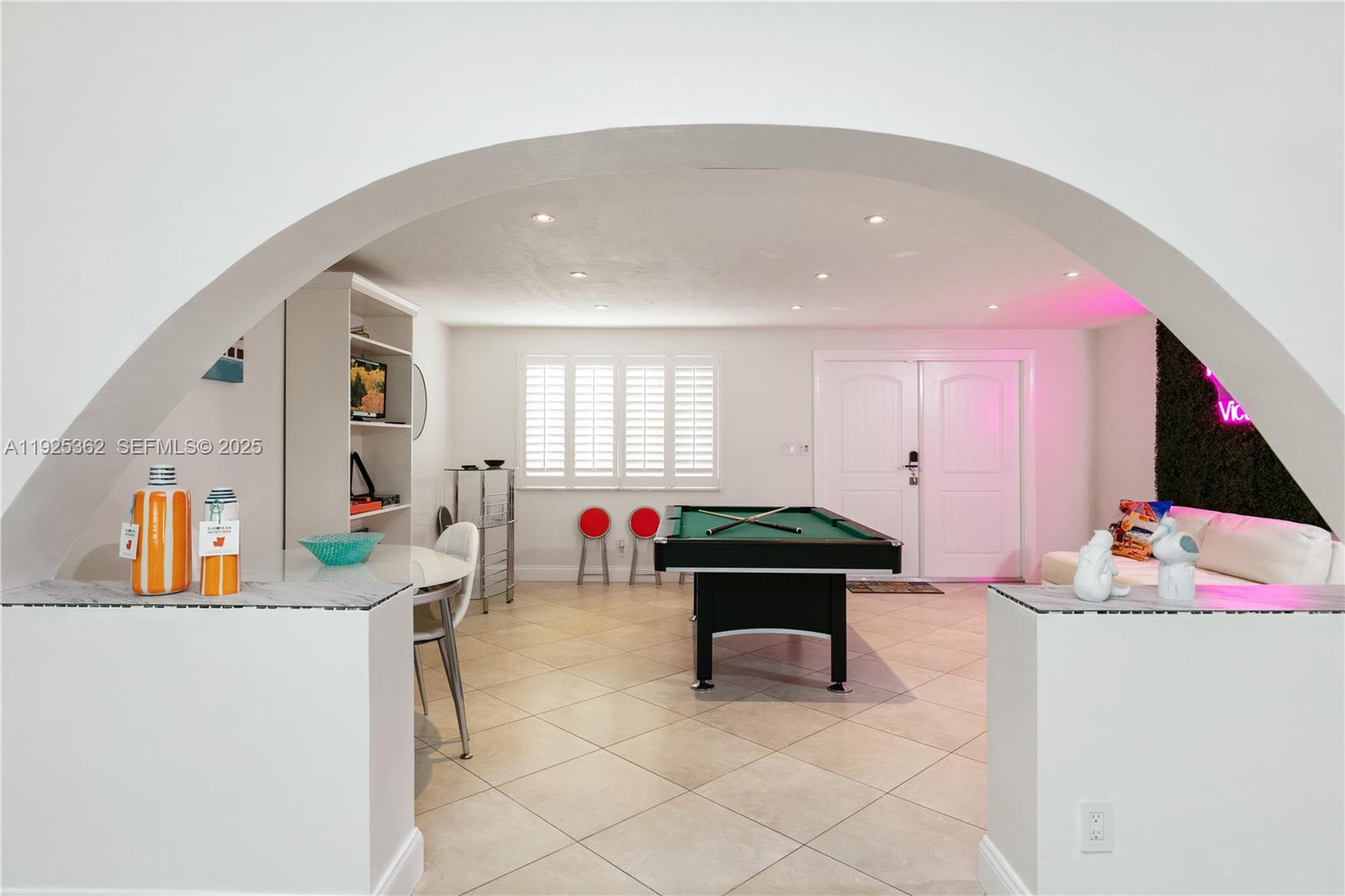 1900 North Victoria Park Road Fort Lauderdale, FL 33305 - Photo 7 of 60 a living room with furniture and a table