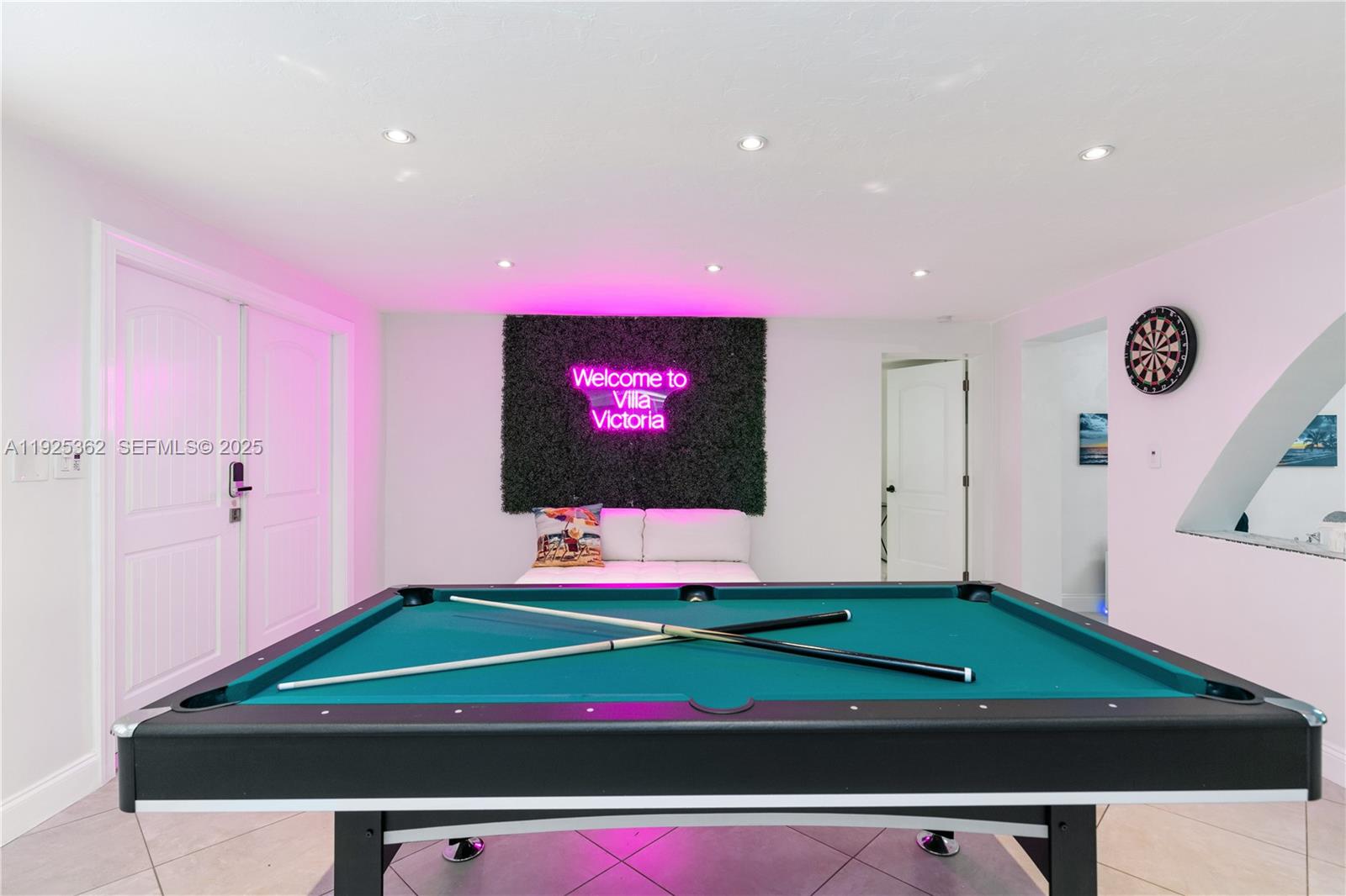 1900 North Victoria Park Road Fort Lauderdale, FL 33305 - Photo 8 of 60 a room with lots of trees and flowers