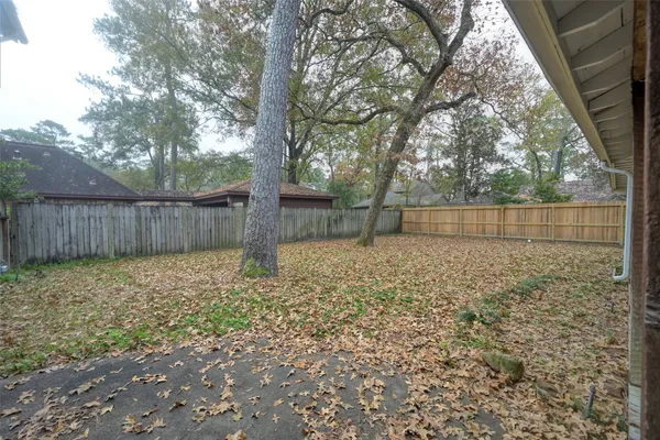 a backyard of a house with lots of green space