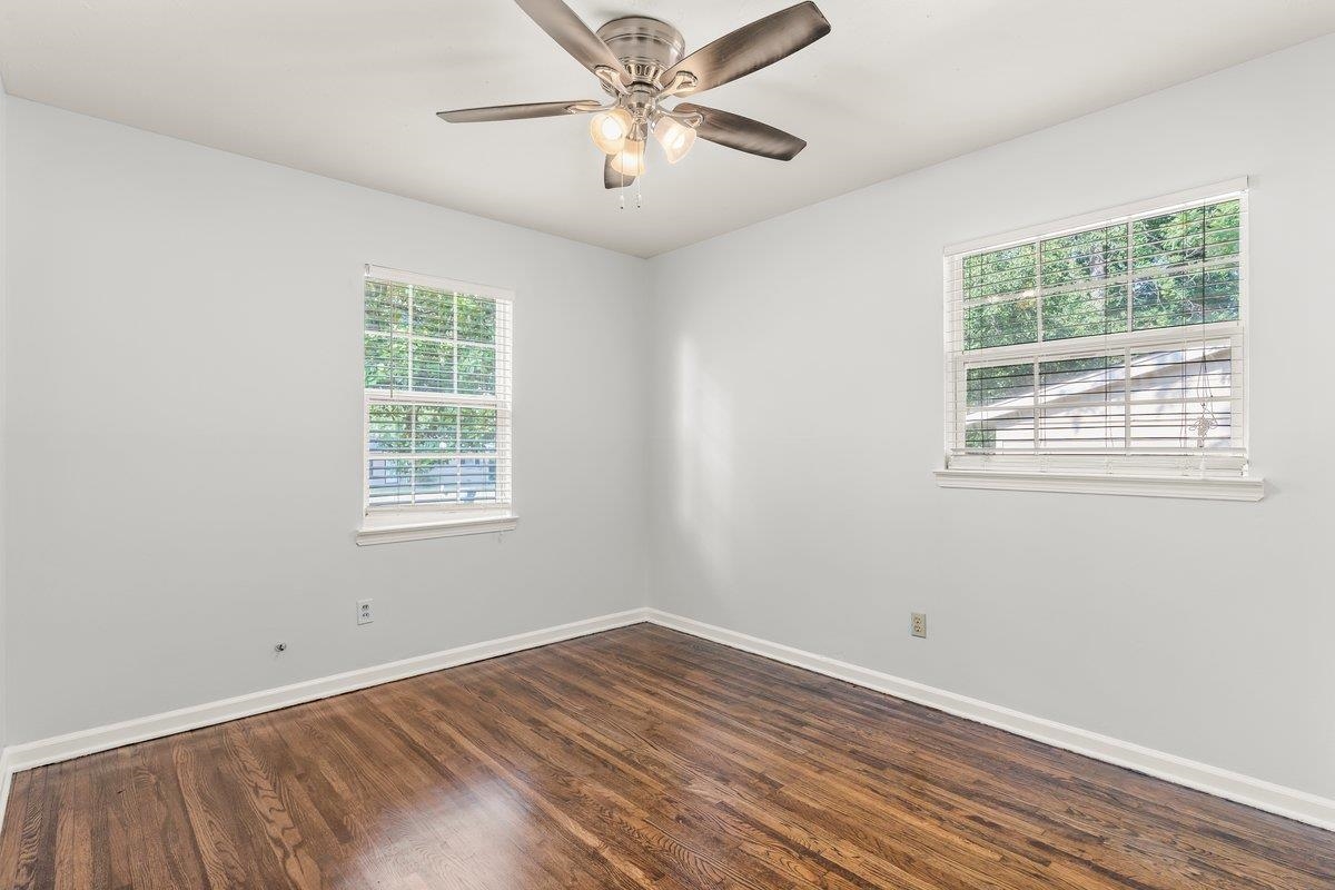 1507 Winfield Road Memphis, TN 38116 - Photo 17 of 25 a view of a room with wooden floor and windows