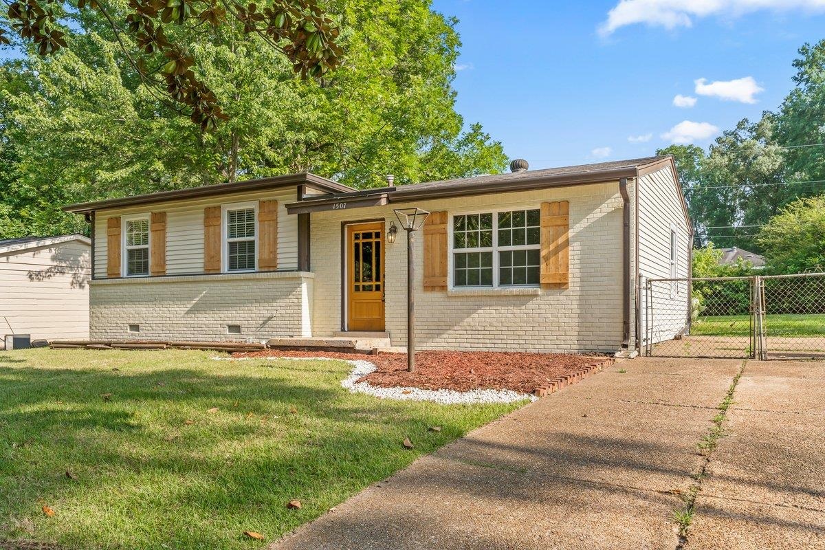 1507 Winfield Road Memphis, TN 38116 - Photo 4 of 25 a house that has a tree in front of it