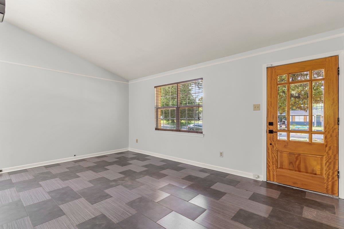 1507 Winfield Road Memphis, TN 38116 - Photo 7 of 25 an empty room with windows