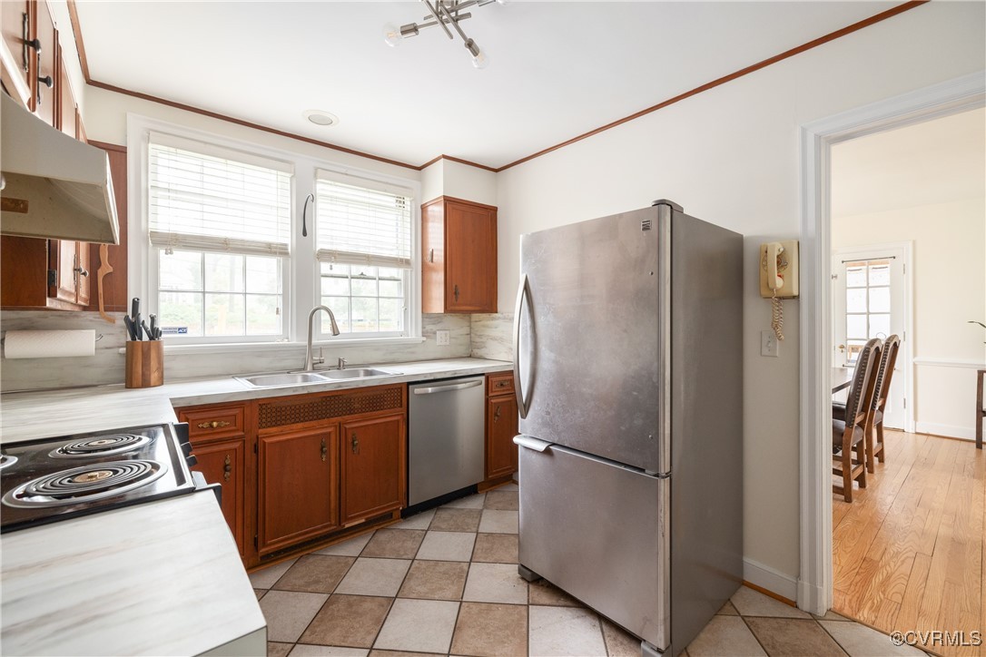 5217 Sylvan Road Richmond, VA 23225 - Photo 17 of 46 a kitchen with stainless steel appliances granite countertop a refrigerator and a stove