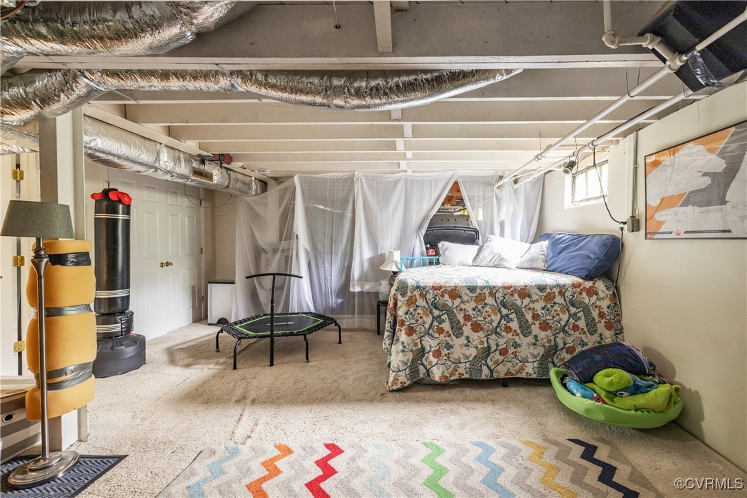 5217 Sylvan Road Richmond, VA 23225 - Photo 30 of 46 a bedroom with furniture and a bed