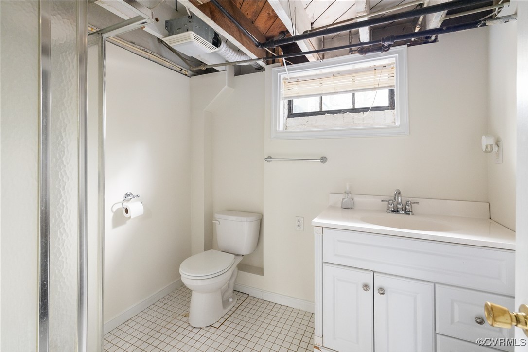 5217 Sylvan Road Richmond, VA 23225 - Photo 33 of 46 a bathroom with a sink toilet and shower