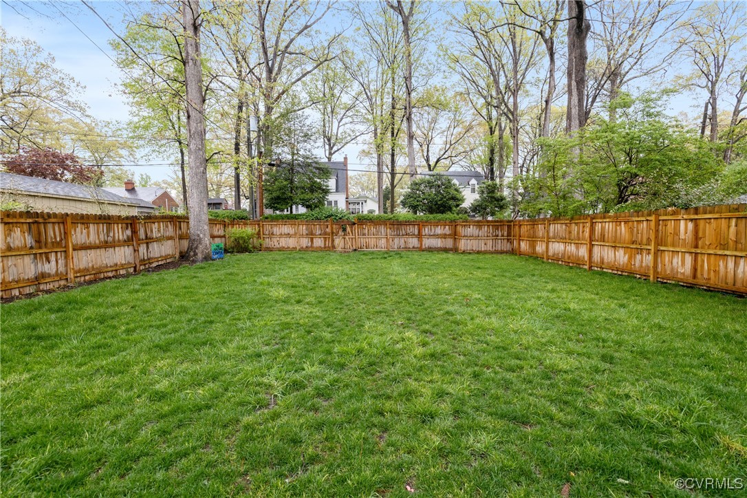 5217 Sylvan Road Richmond, VA 23225 - Photo 43 of 46 a view of a backyard with large trees