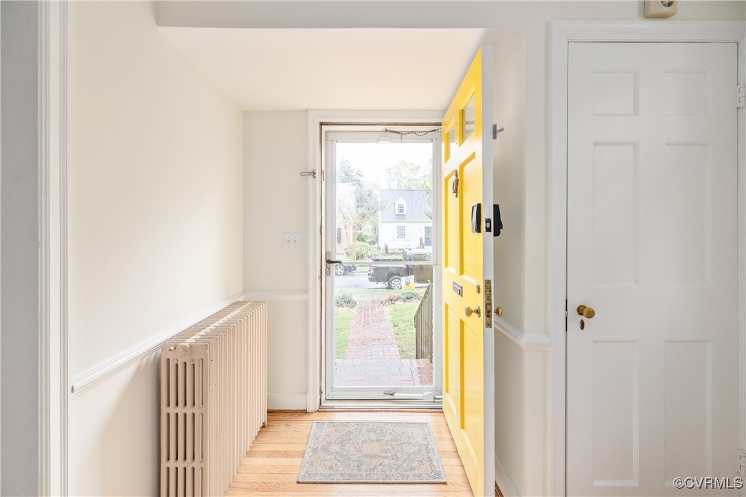5217 Sylvan Road Richmond, VA 23225 - Photo 6 of 46 a view of a hallway with wooden floor and door