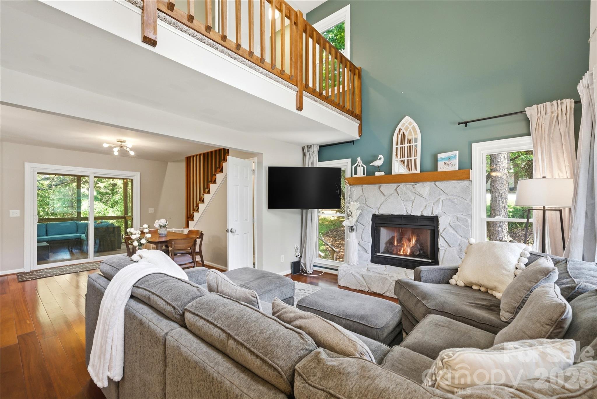 3066 Point Clear Drive Fort Mill, SC 29708 - Photo 13 of 47 a living room with furniture a fireplace and a flat screen tv