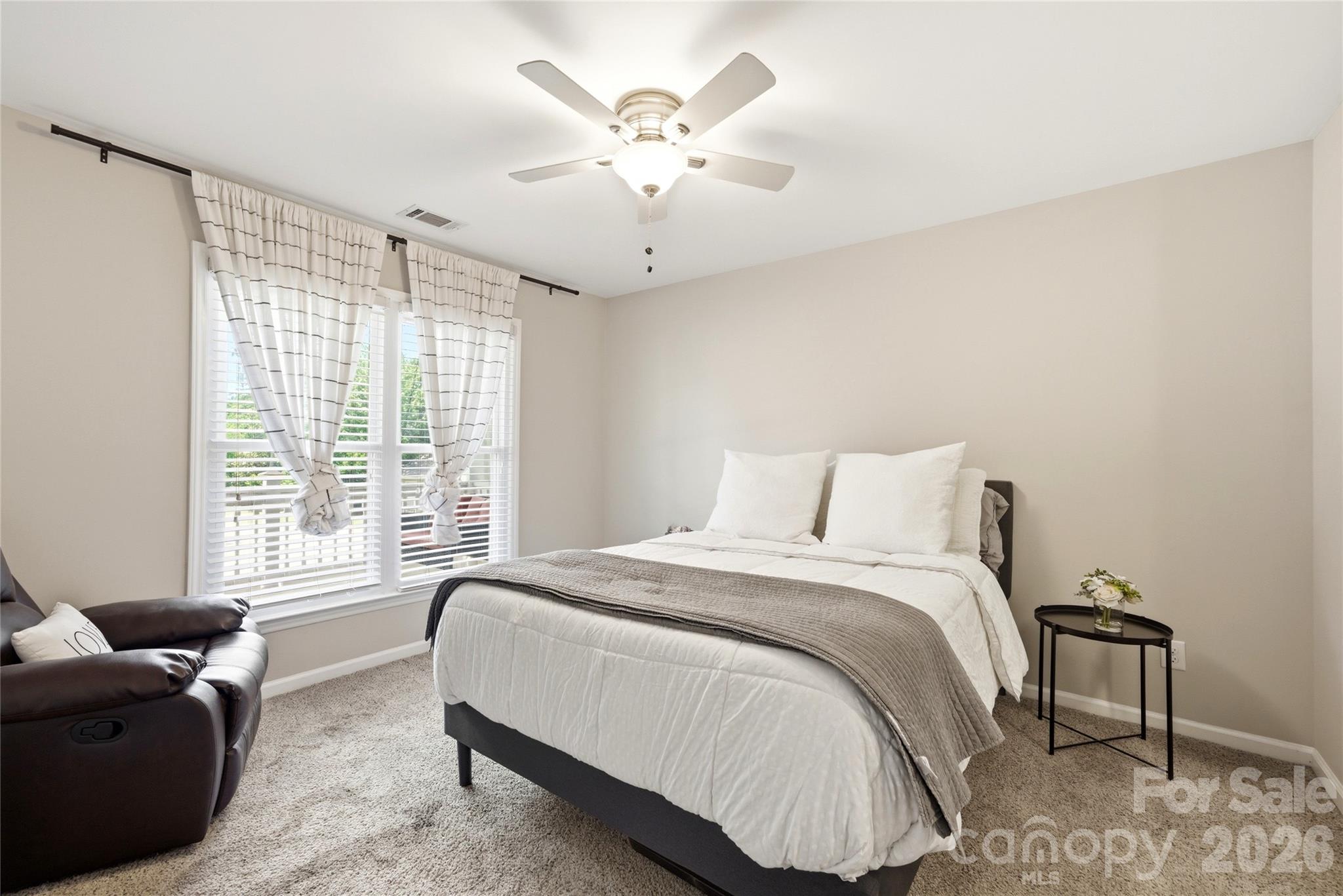 3066 Point Clear Drive Fort Mill, SC 29708 - Photo 20 of 47 a spacious bedroom with a bed and a couch